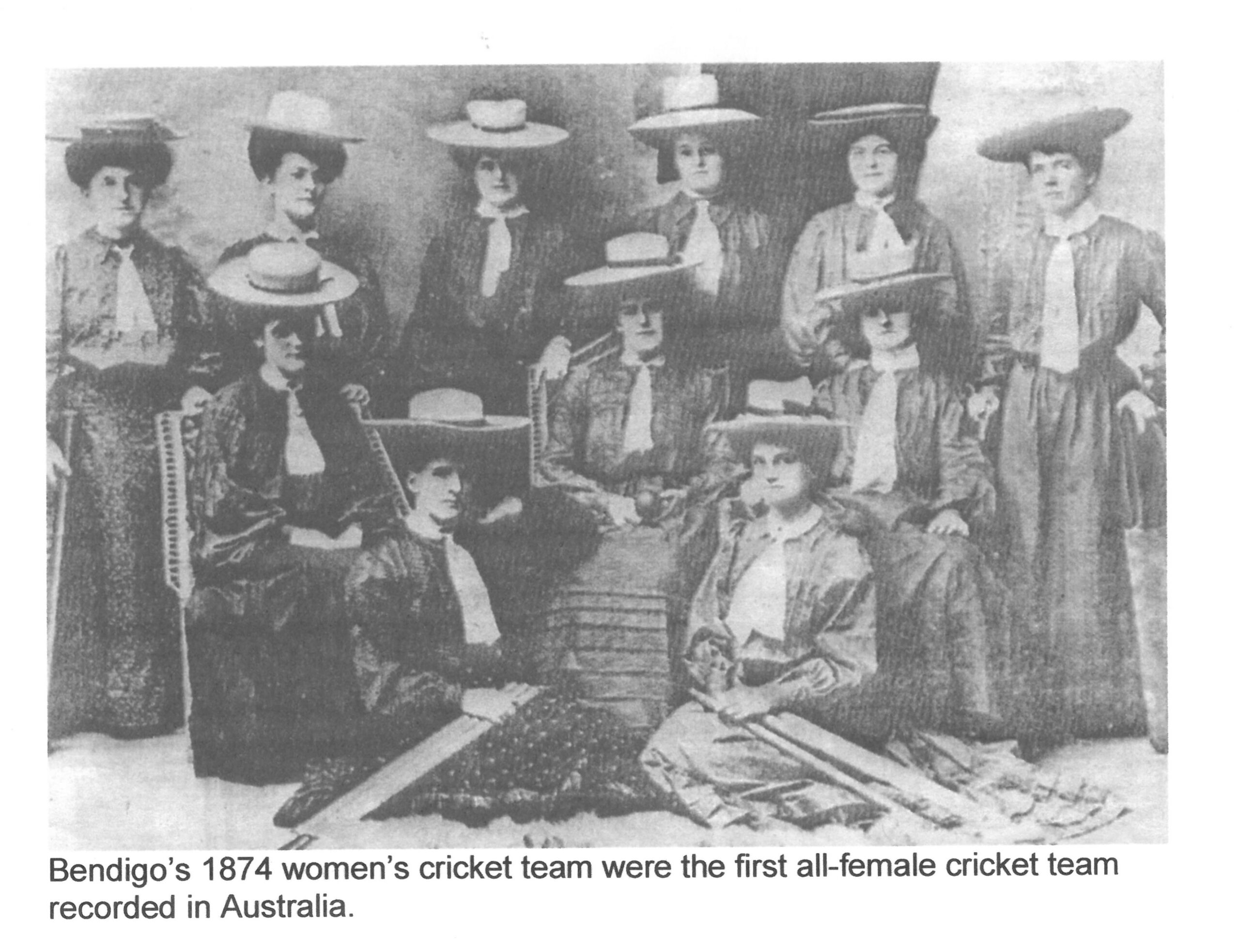 Black and white group portrait of women cricket players.